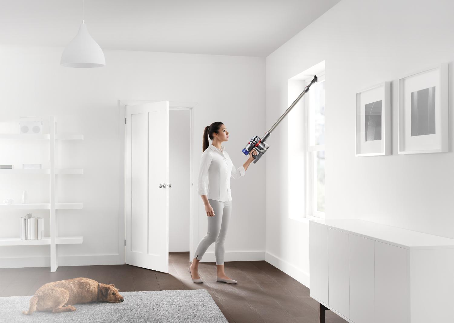 Model using the Dyson V8™ vacuum